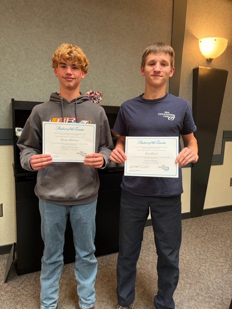 Two students holding their Student of the Quarter Certificates from BCTC