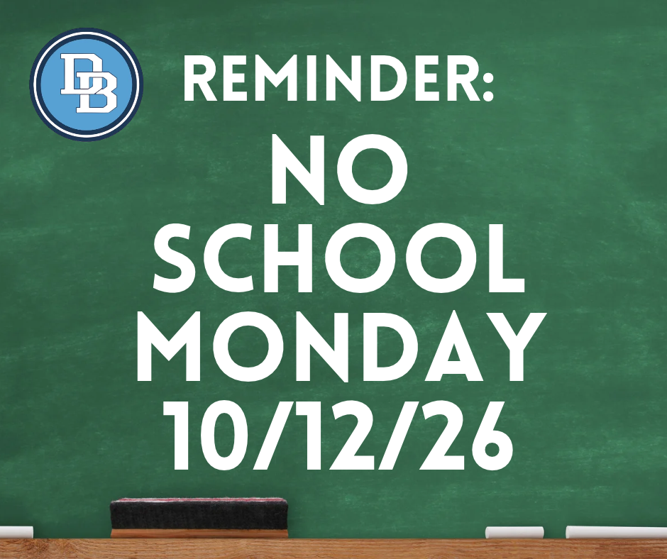 Green chalkboard background with white chalk sticks and a black eraser on a wood tray at the bottom of the screen. DB logo in top right corner. Reads: REMINDER: NO SCHOOL MONDAY 10/12/26