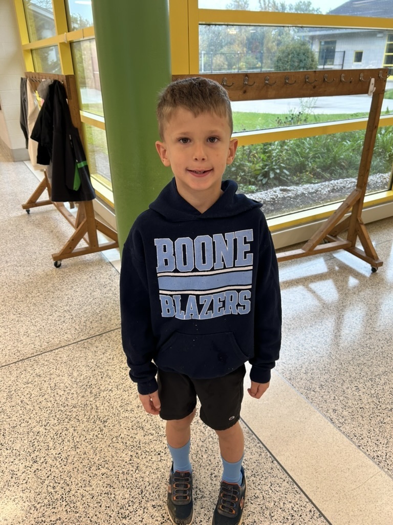 Student wearing a black hooded Blazers sweatshirt