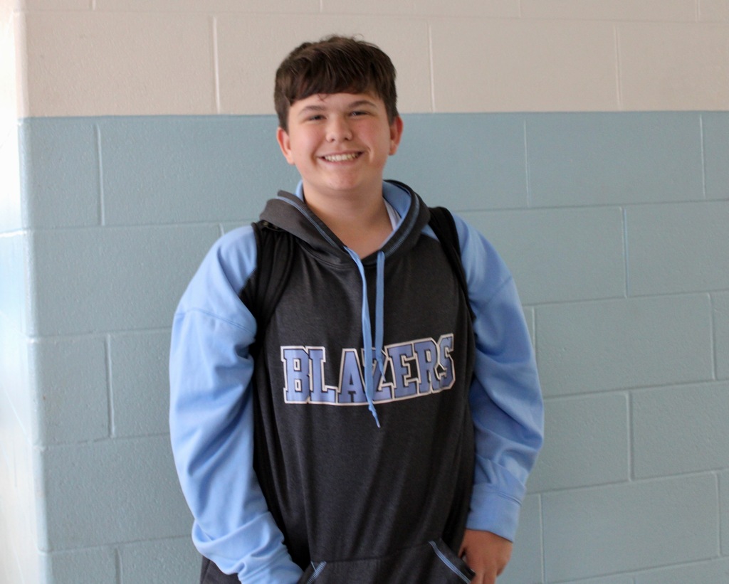 Student wearing his Blazers hoodie.