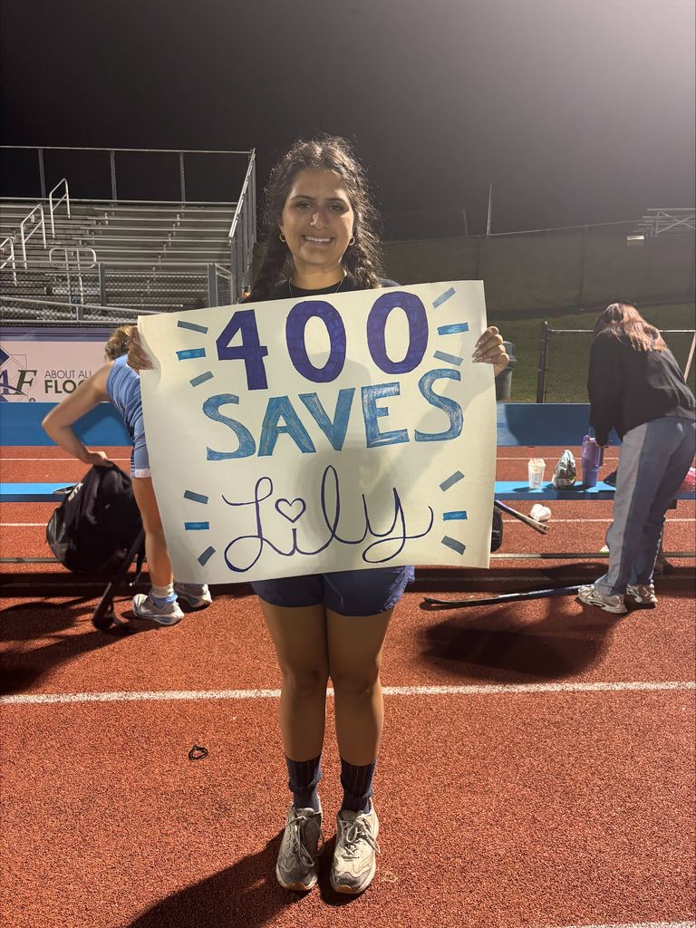 Student holding a sign that reads 400 Saves Lily