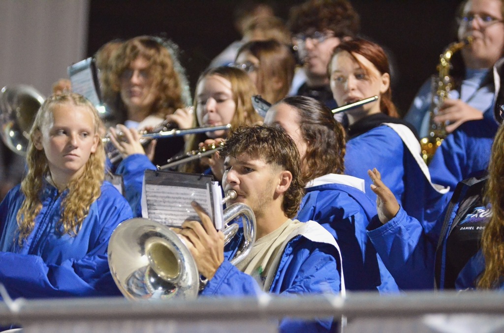 The band plays a song in the stadium seats