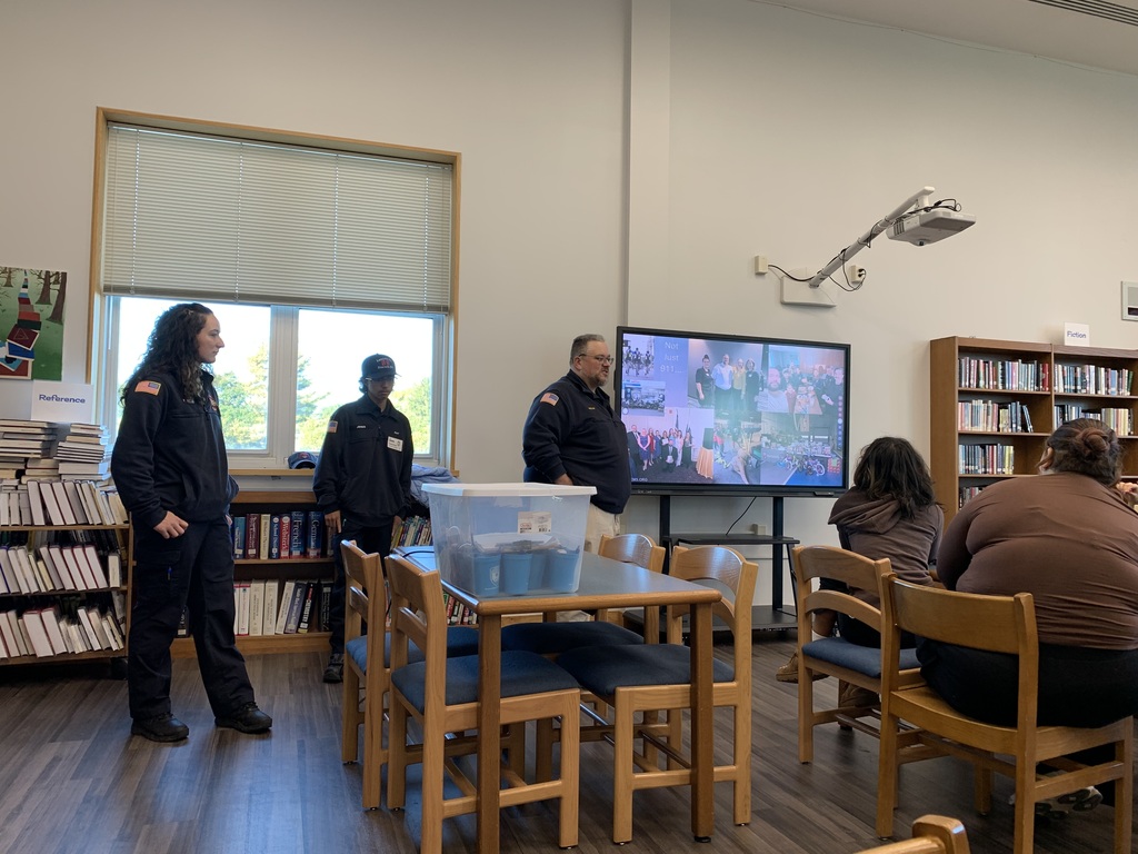 Three EMS workers talk to students about their jobs in our high school library