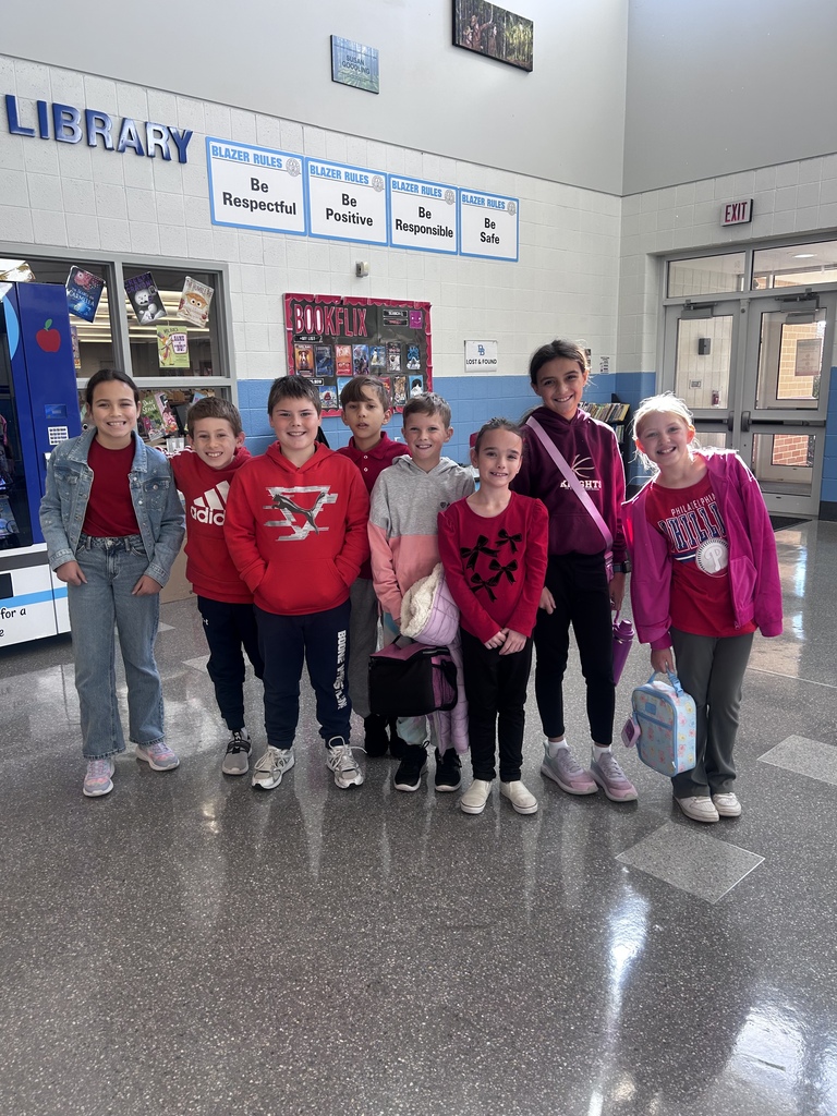 Eight students smile for the camera while wearing Red for today's Red Ribbon spirit week.