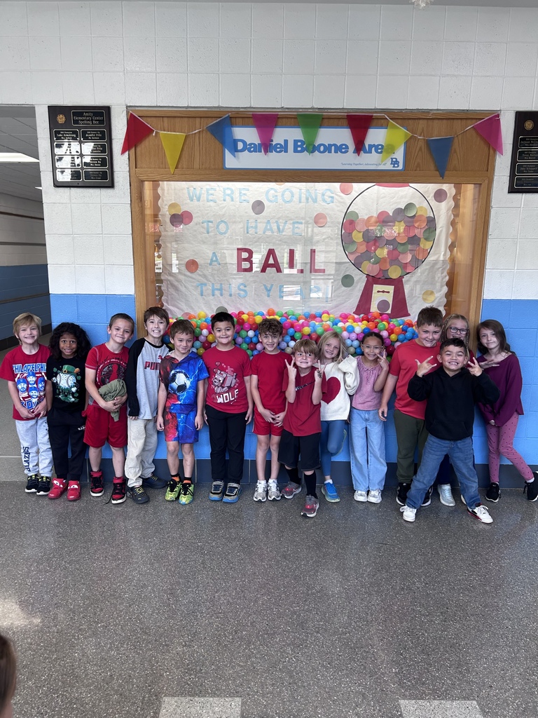 Fourteen students smile for the camera while wearing Red for today's Red Ribbon spirit week.