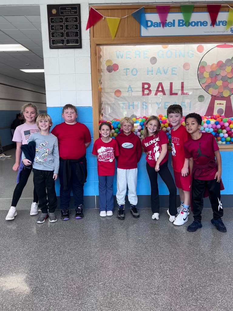 Eight students smile for the camera while wearing Red for today's Red Ribbon spirit week.