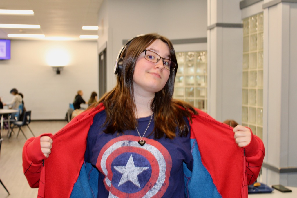 A student poses wearing a Captain America t-shirt