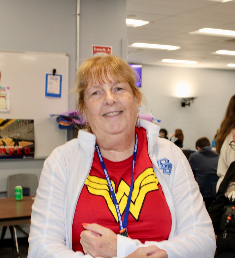 A teacher shows off her Wonder Woman t-shirt