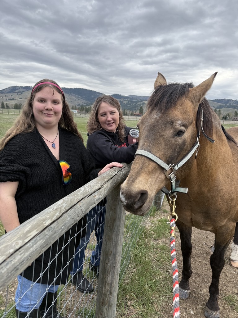 two people with horse