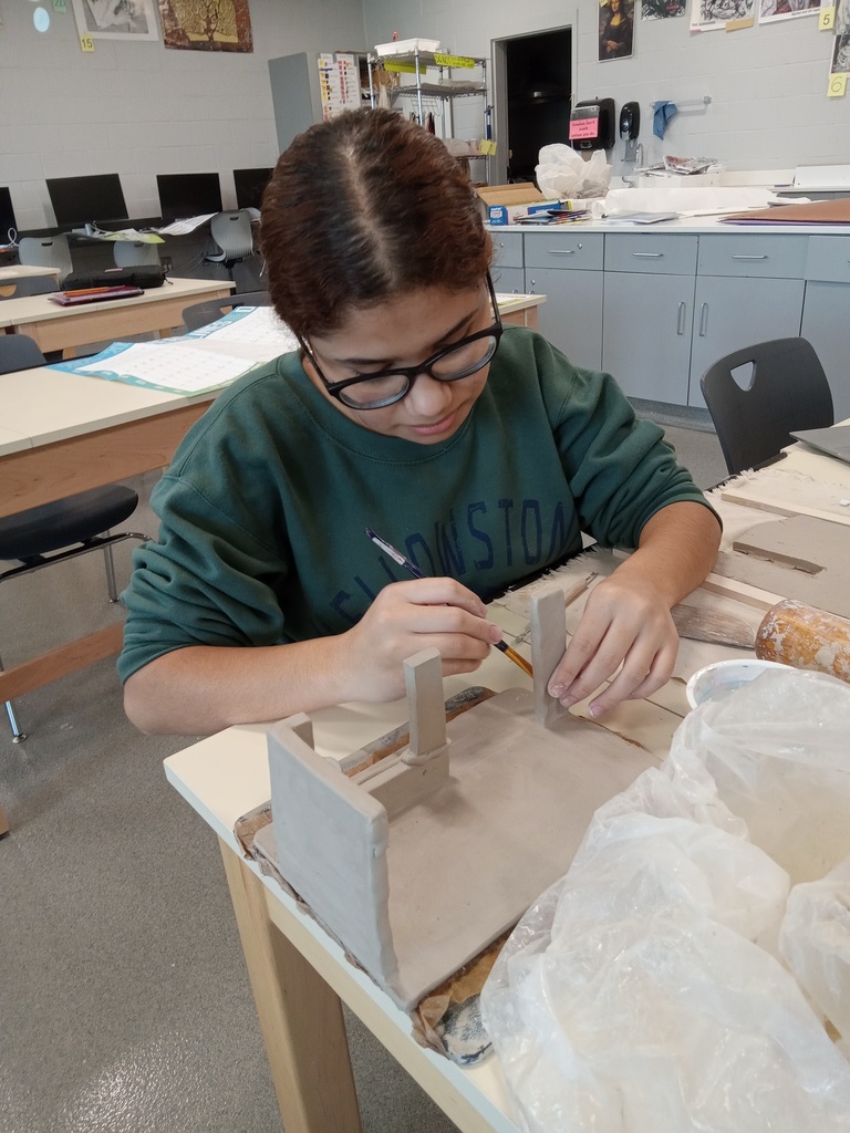 Jami working hard on her clay slab project
