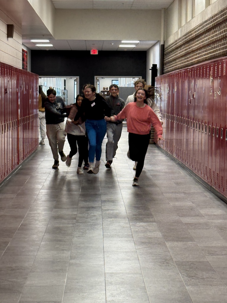 Racing down the hall to their last clue!