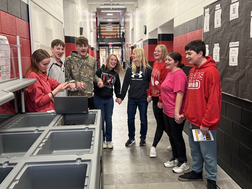 One of the teams are karaoking as part of their challenge.