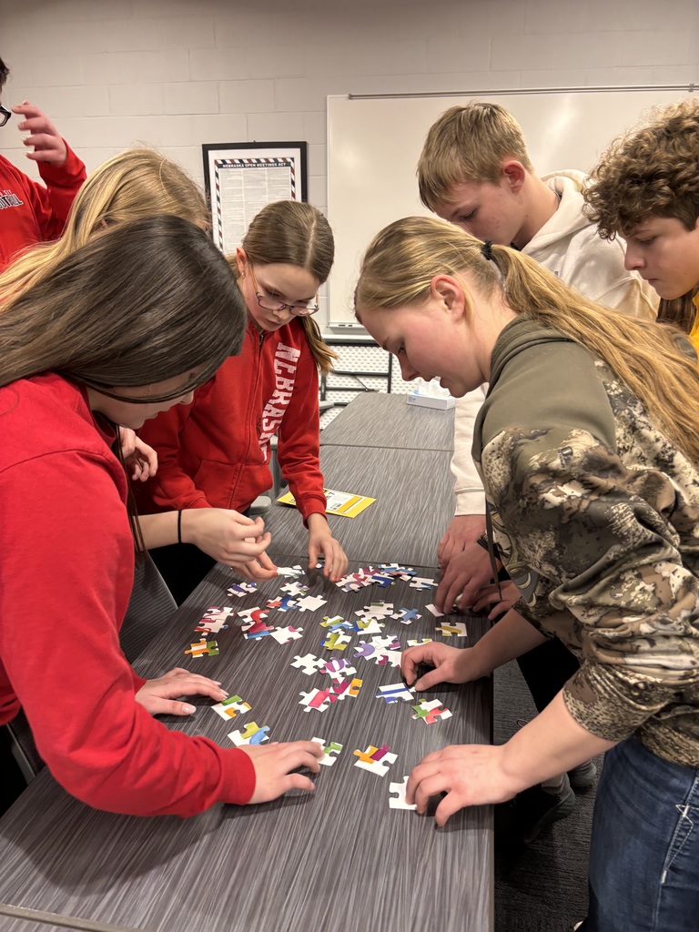 One group is frantically putting the puzzle pieces together to discover the secret message. 
