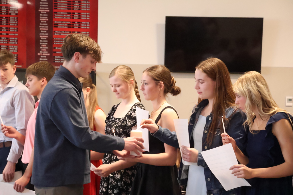 Candles are being lit for the induction.