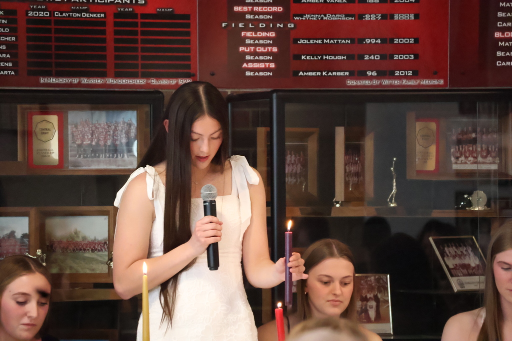 Addi lighting the purple candle (leadership).