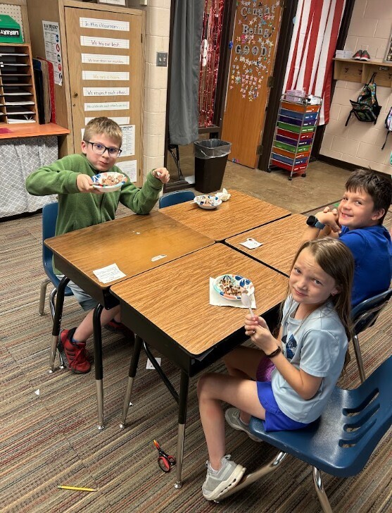 Enjoying their earned Ice Cream Sundae!