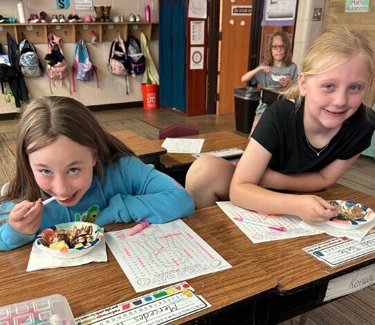Enjoying their earned Ice Cream Sundae!