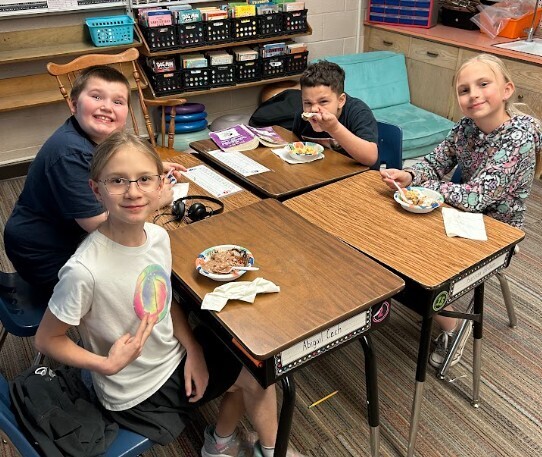 Enjoying their earned Ice Cream Sundae!