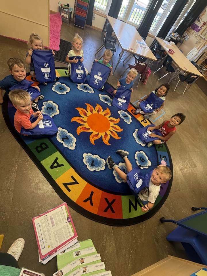 preschool students receiving their Just Right Readers