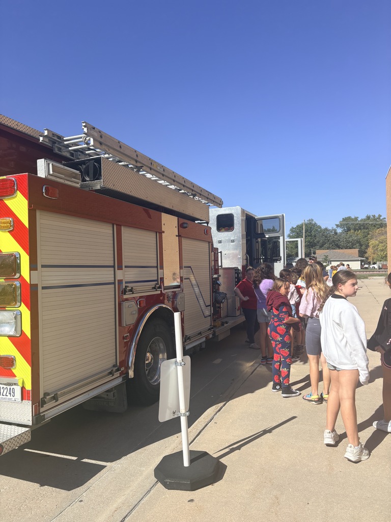 kids looking at fire truck