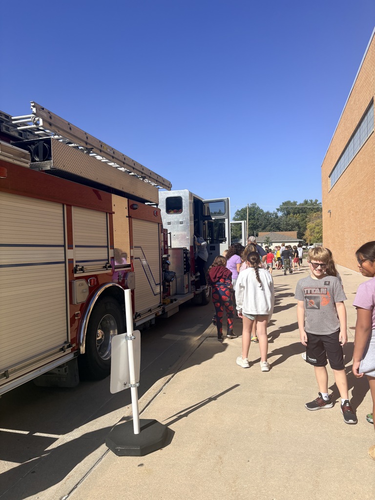kids looking at fire truck