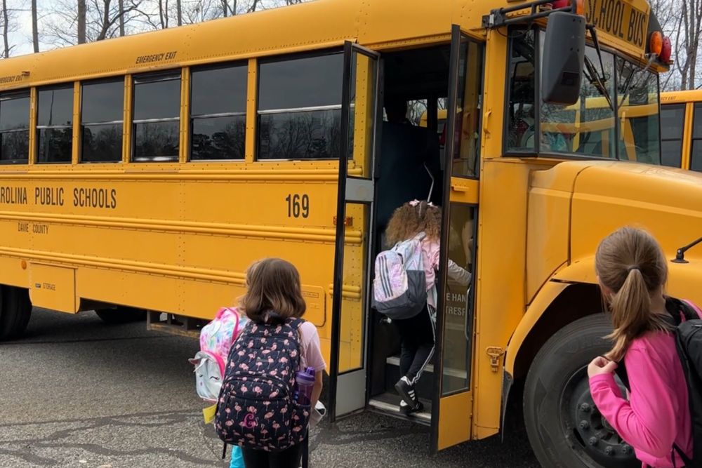Students getting on bus