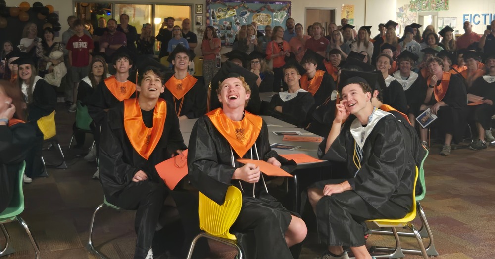 Graduates gathered and laughing