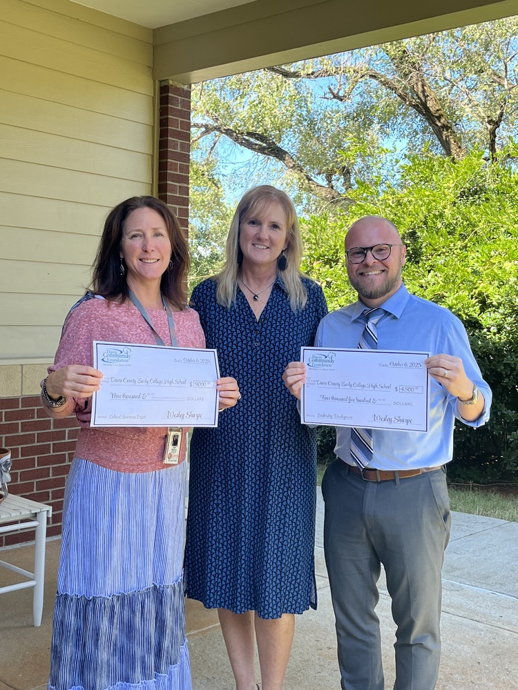 Photo of receiving grant checks