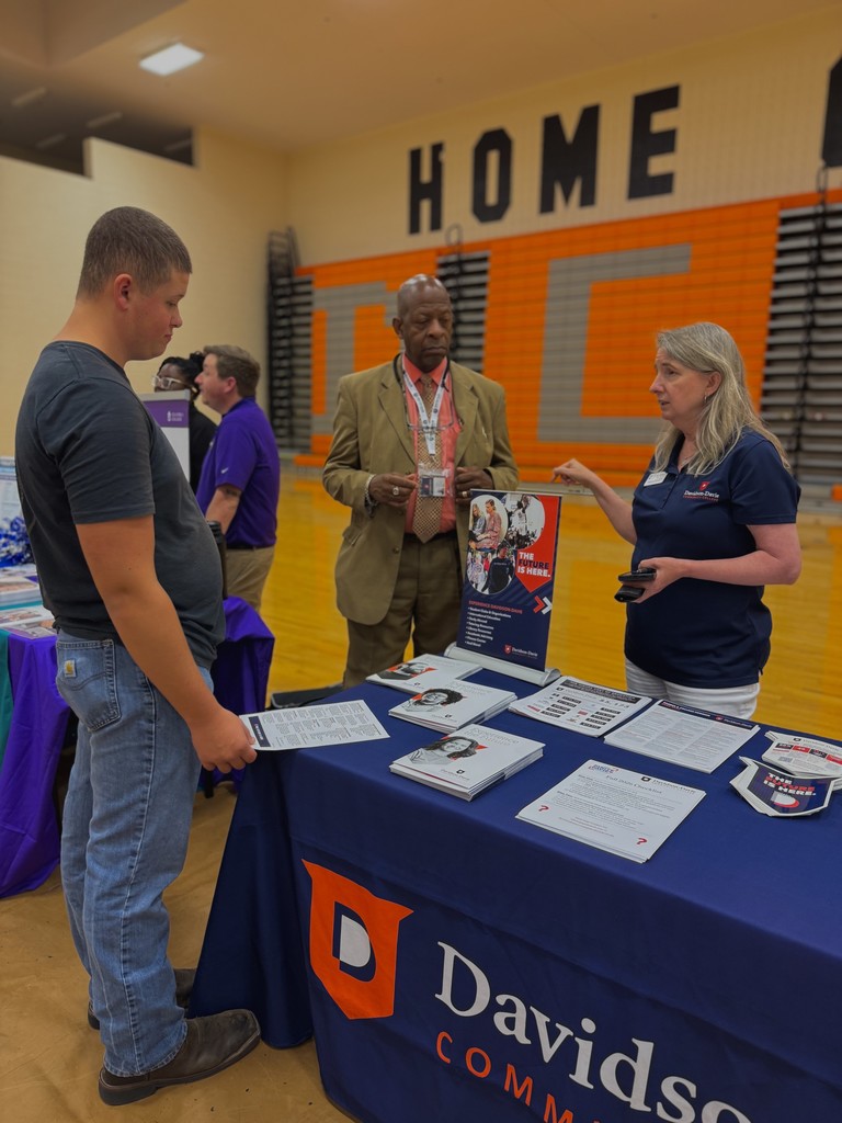 Students showing flyers from various colleges