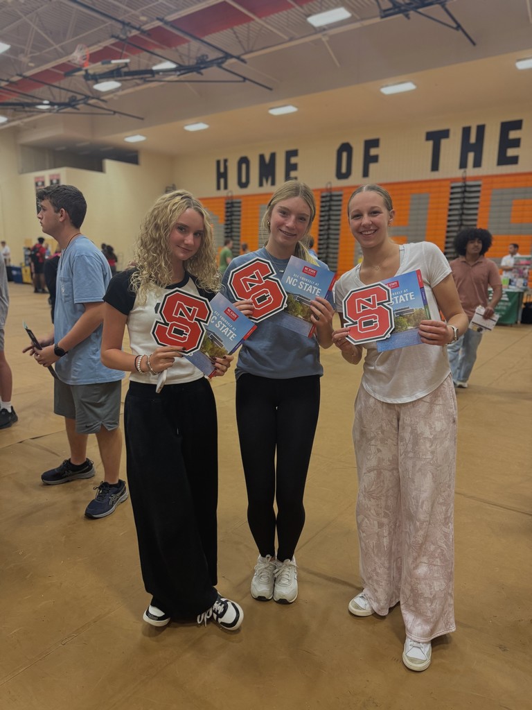 Students showing flyers from various colleges