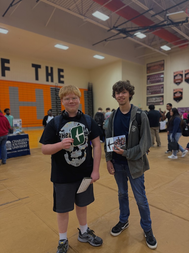 Students showing flyers from various colleges