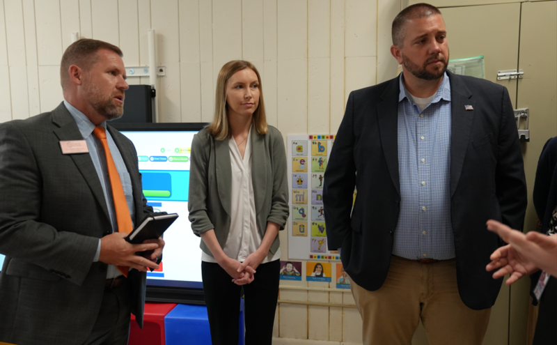 three people standing