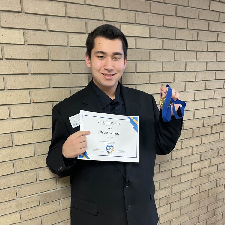 Zach Mason with his awards