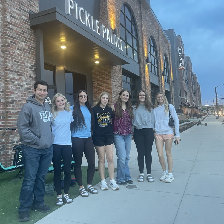 FBLA competitors post for a picture outside Pickle Palace