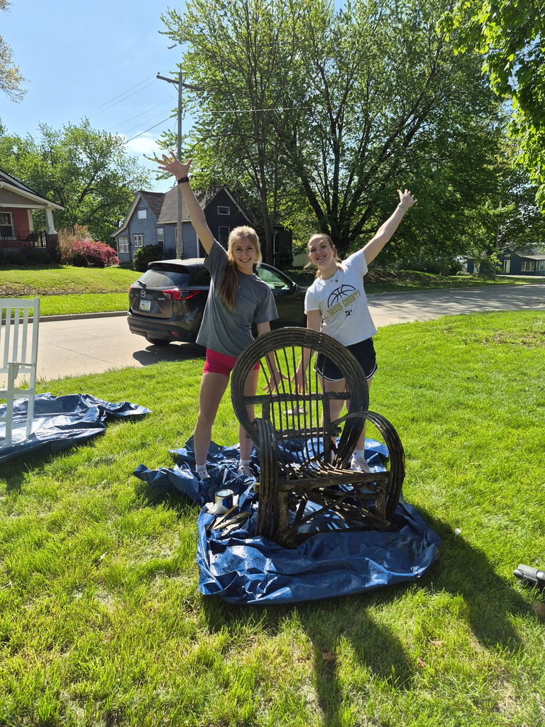 Students with their painted chair