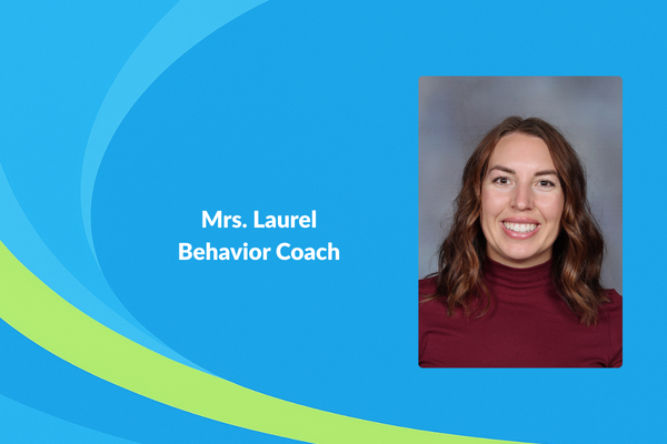 Mrs. Laurel behavior coach photo of women with shoulder length brown hair and maroon shirt smiling