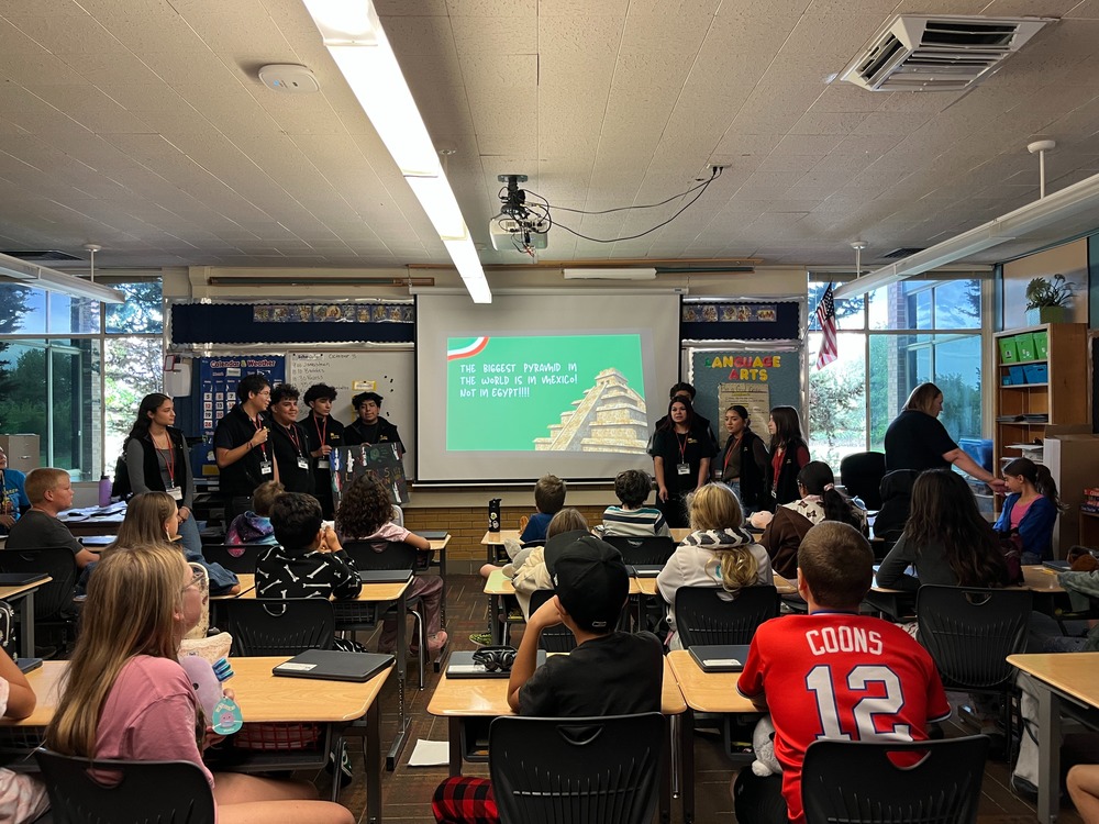 Students from Viewmont high's Latinos in Action club teaching Meadowbrook students about their native countries