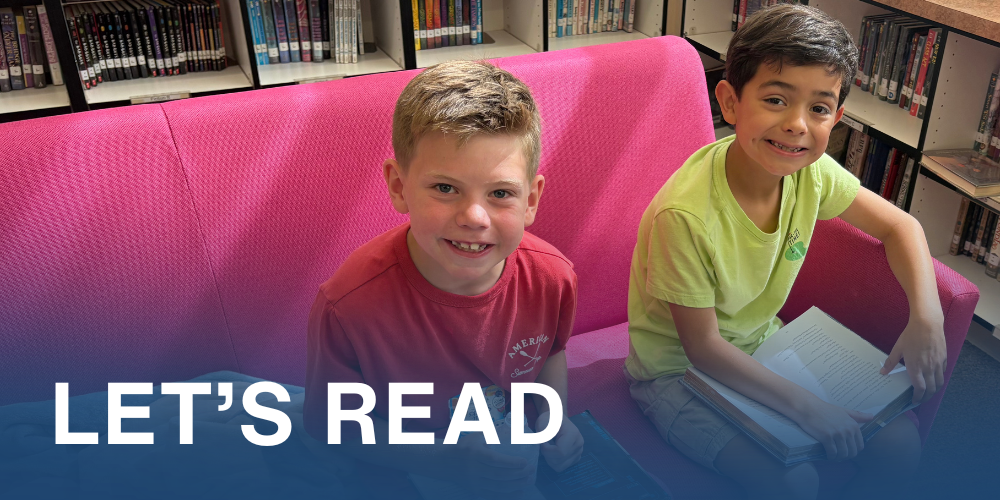 two students sit and read