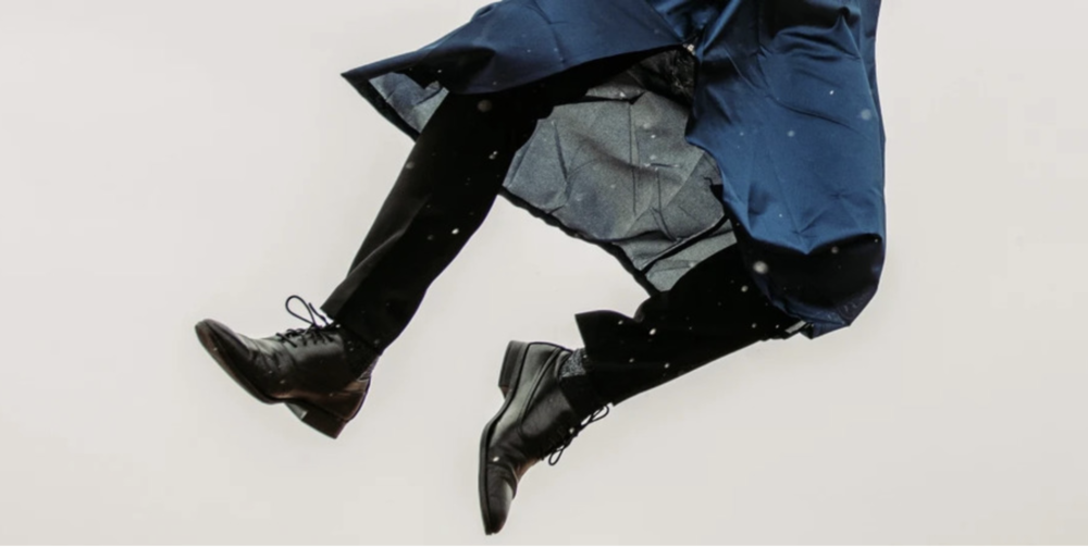 Graduate jumping and heel clicking