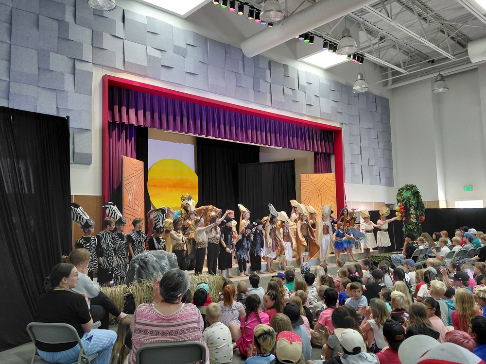 Students in The Lion King school music during their final bows. Just performed for the school.