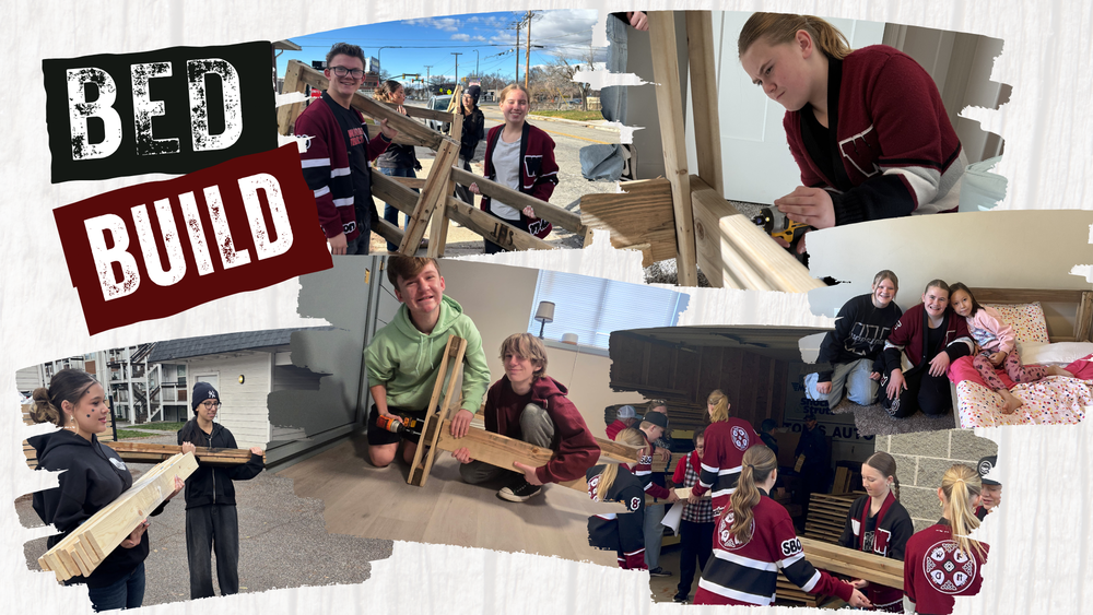 Bed Build, students working on and building beds for their community. Carrying wood using drills. 