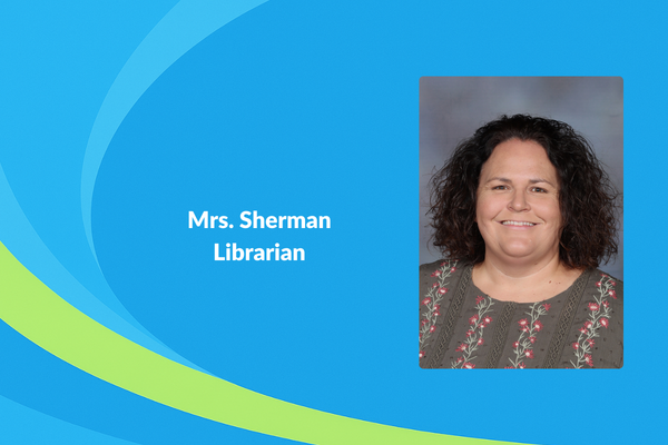 Mrs. Sherman Librarian photo of women with floral shirt and curly shoulder length brown hair