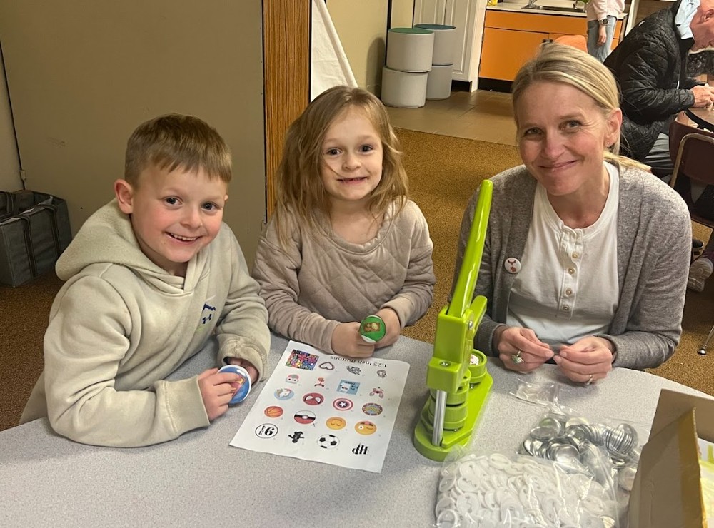students and teacher during an activity at literacy night
