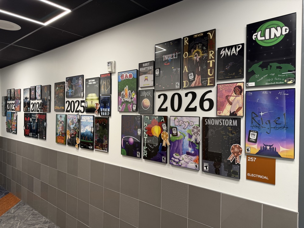images showing game development hallway featuring 35  video game posters from the past 4 years, 2023-2026
