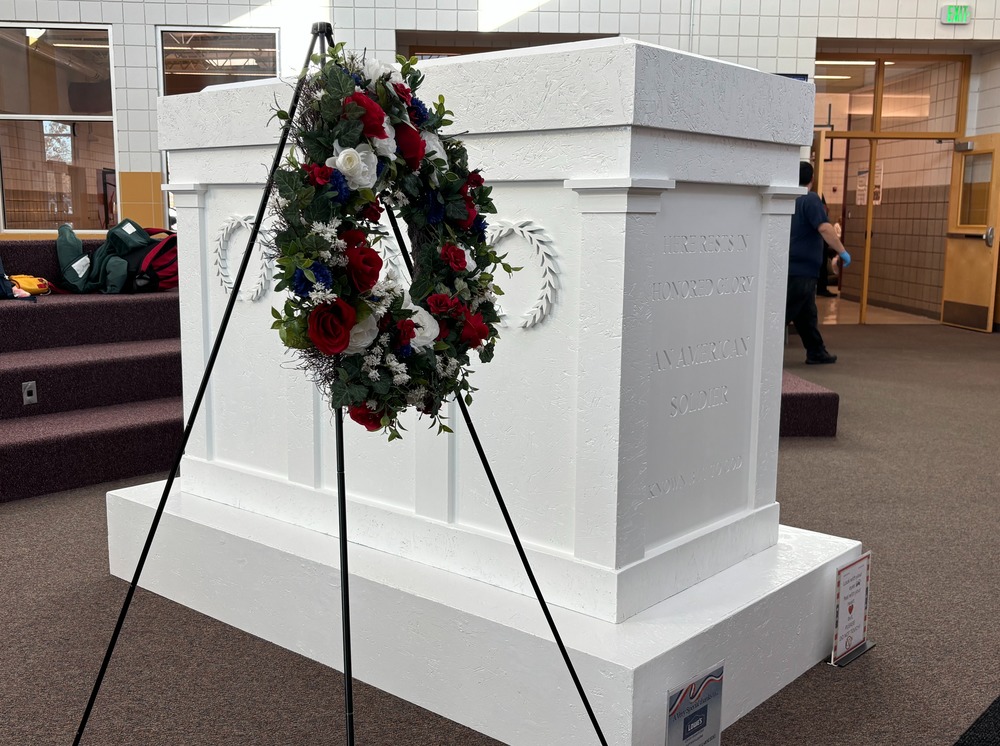 Replica of the Tomb of the Unknown Soldier with a wreath on a stand in front