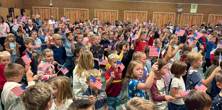 Image of students waving flags