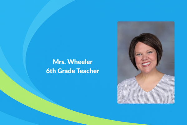 Mrs. Wheeler 6th grade teacher photo with short brown hair and grey shirt