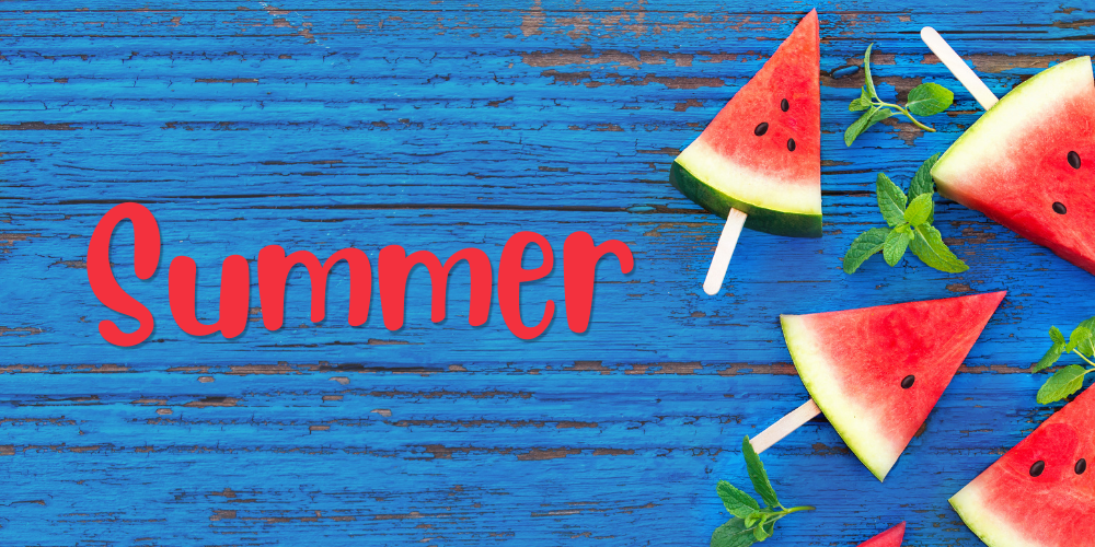 Summer in red with blue painted wood background and watermelon popsicles