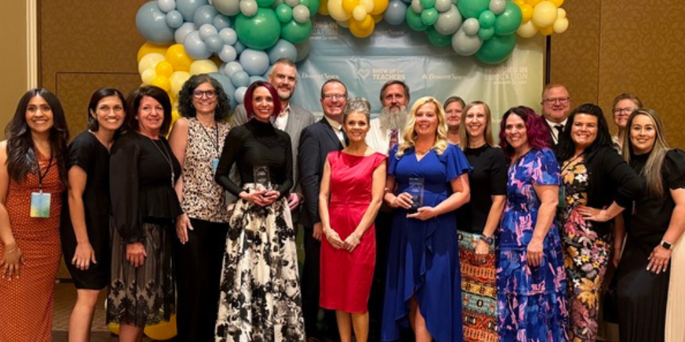 Group photo of people winning awards. 