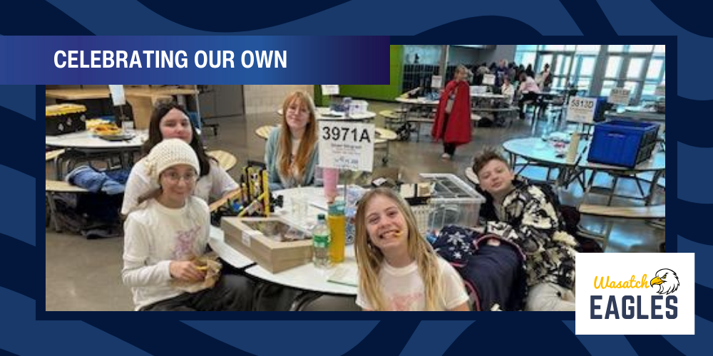 Vex Robotics Team sitting at a table waiting for competition.
